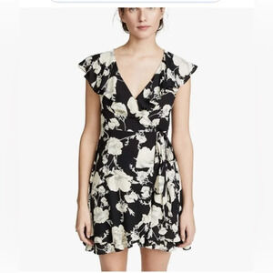 Gently used Free People Wrap dress in black floral‎ print.  Size XS G0199